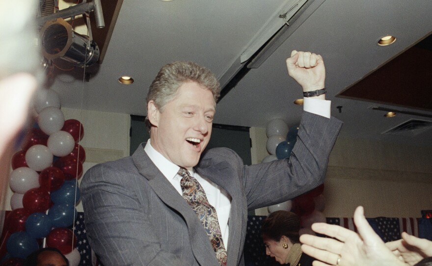 Bill Clinton raises his fist before a crowd of supporters in New Hampshire. His second-place finish in the state's 1992 primary helped rejuvenate his candidacy.
