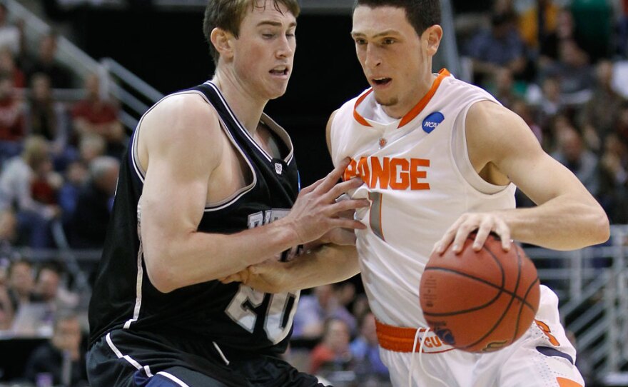 Syracuse's Andy Rautins, right, drives against Butler's Gordon Hayward during the first half of their game in Salt Lake City Thursday night.