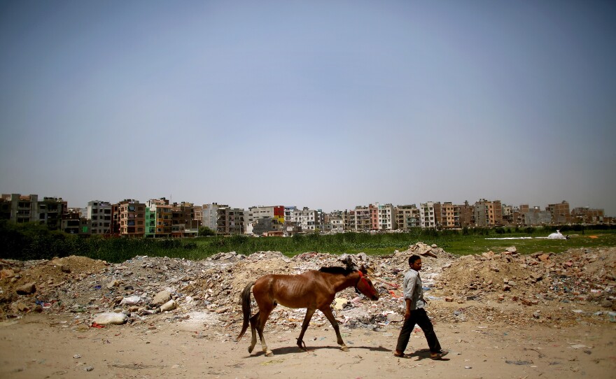 Thousands set up rudimentary homes along the floodplain, only to dismantle them when the monsoons flood them, and many of their belongings, out.