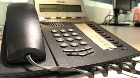 A phone is pictured on a desk, May 11, 2018. 
