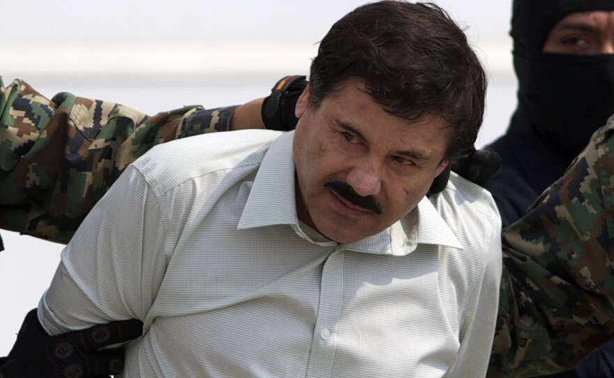 Joaquin "El Chapo" Guzman is escorted to a helicopter in handcuffs by Mexican navy marines at a navy hanger in Mexico City on Saturday. A senior U.S. law enforcement official said that Guzman, the head of Mexico's Sinaloa Cartel, was captured alive overnight in the beach resort town of Mazatlan.