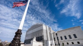 An American flag is seen outside the Supreme Court, in Washington, D.C., in November. This week, the high court will hear oral arguments for a case that could change who gets to be a U.S. citizen.
