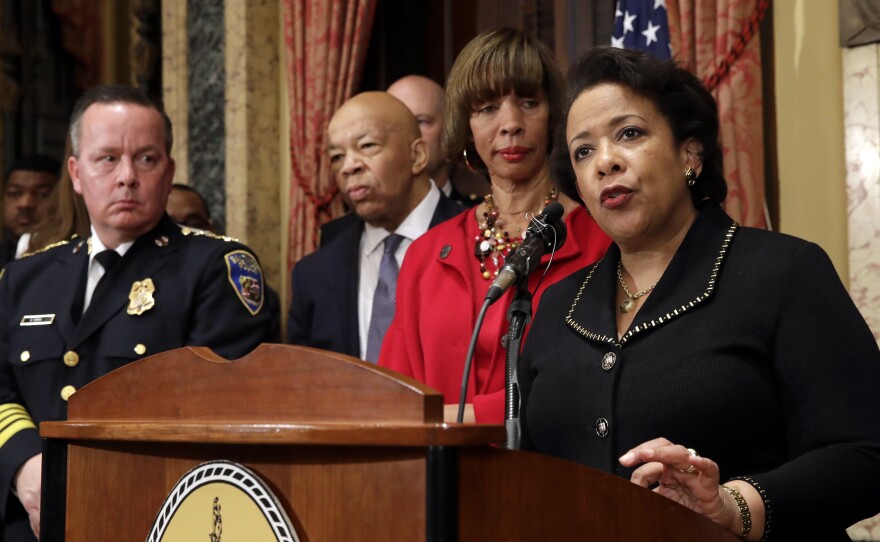 Attorney General Loretta Lynch (right), speaks during a joint news conference to announce the Baltimore Police Department's commitment to a sweeping overhaul of its practices under a court-enforceable agreement with the federal government on Thursday.