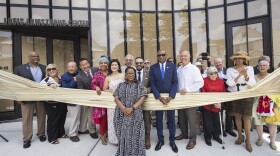 Regina Bain, executive director of the Louis Armstrong House Museum, leads a ribbon-cutting for the brand-new Louis Armstrong Center on June 29 in Queens, New York.