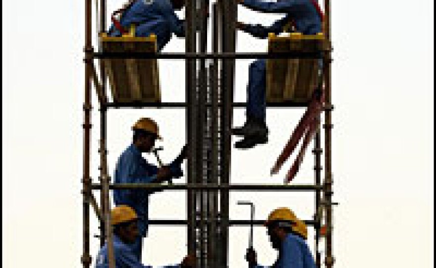Foreign laborers are driving the building boom in Dubai, where scores of skyscrapers and towers are under construction.