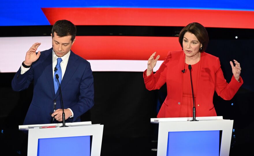 Former South Bend, Ind., Mayor Pete Buttigieg and Minnesota Sen. Amy Klobuchar speak during Tuesday's Democratic primary debate in Des Moines, Iowa.