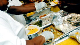 Soul food dinner being served.
