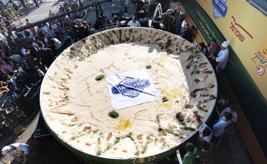 <strong>Counterattack:</strong> On Jan. 8, 2010, the Arab Israeli village of Abu Gosh served up this giant satellite dish full of hummus, weighing over 4 tons — about twice as much as the previous record set by Lebanon just months earlier.