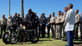 Police and emergency room doctors hold a press conference to consider the risks of  electric bikes and motorcycles in San Diego on Sept. 8, 2025