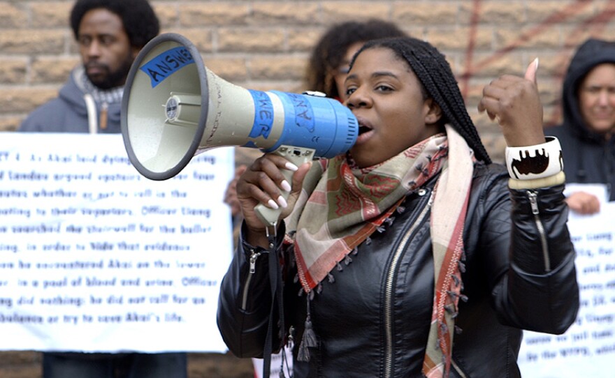 Film subject Kerbie Joseph speaks in support of Akai Gurley near the Euclid Avenue A-train subway stop in Brooklyn, N.Y.