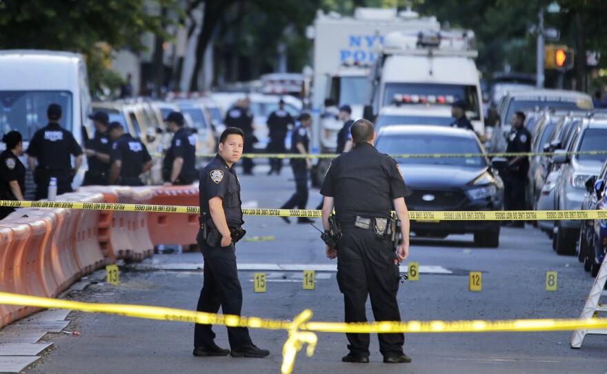 Numbers mark a crime scene near the site where a police officer was fatally shot in the Bronx early Wednesday.
