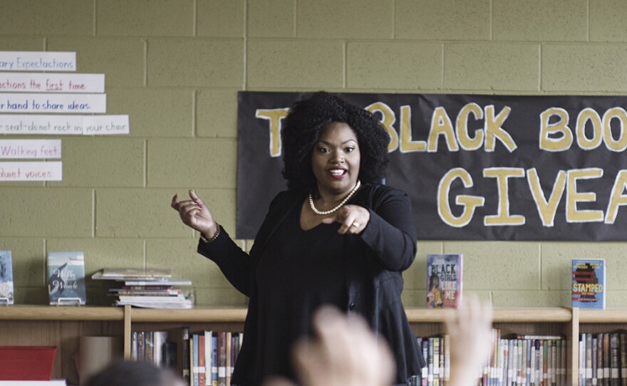 Meredith McKinney, founder of the Black Book Project, at an elementary school book giveaway.