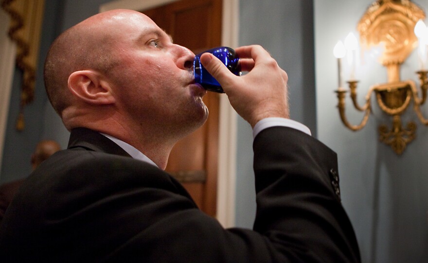 Gregg Kelley of California Olive Ranch taste tests his competitor's brand.