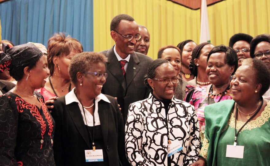 Rwandan President Paul Kagame (center) has been a proponent of putting women in positions of power. He's shown participating in a 2010 conference at the nation's Parliament to discuss the role of women.