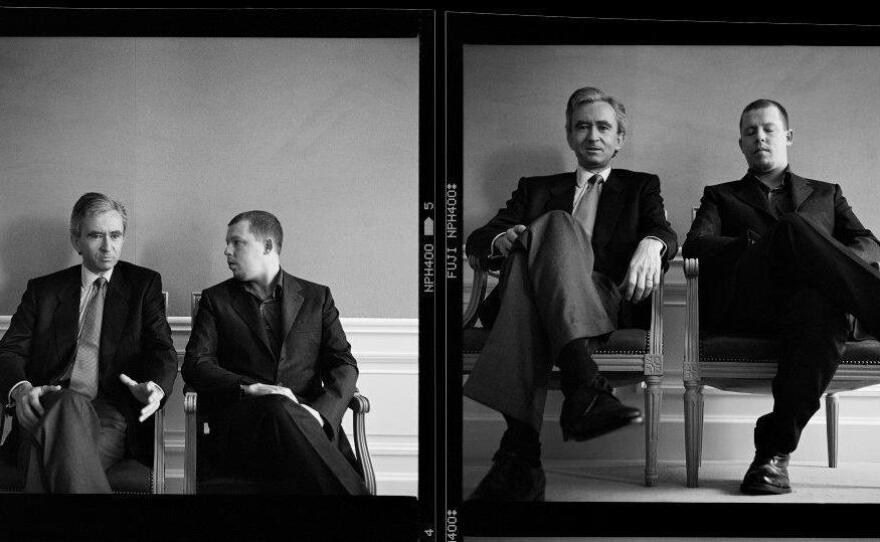 Bernard Arnault (left), the real-estate-developer-turned-luxury-fashion-magnate, and Alexander McQueen were photographed in 1998 for Holly Brubach's profile of Arnault for The New York Times. Arnault had appointed McQueen as Givenchy's head designer two years earlier; Arnault could have chosen anyone to appear in the photo with him and chose McQueen.