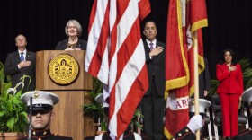 San Diego City Council President Todd Gloria and Councilwoman Sherri Lightner lead the audience in a pledge of allegiance during the City Council inauguration ceremonies, Dec. 10, 2014. 
