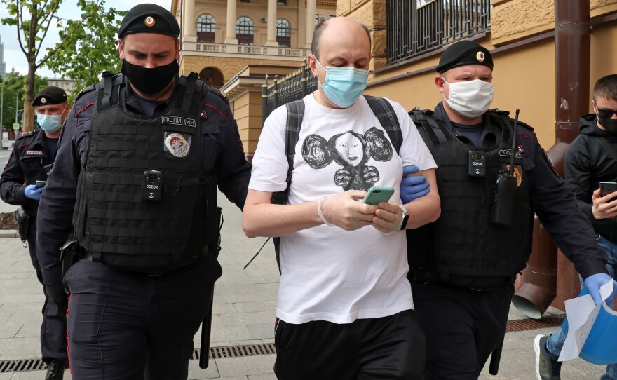 Sergei Smirnov, pictured being detained at a "solo protest" in May 2020, was sentenced to 25 days in jail on Wednesday for allegedly calling on people to protest through a Twitter repost.