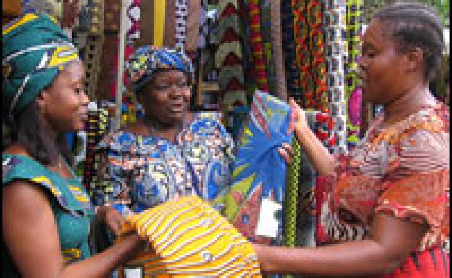 In Kinshasa, Congolese traders sell brightly printed cloth popular throughout west and central Africa. Cheaper Chinese textiles have muscled in on what used to be a flourishing local industry. "That's free markets for you," says Henriqueta Salvador (center) . "People complain that it's poor quality, but if you know how to take care of this Chinese fabric, it lasts a long time."