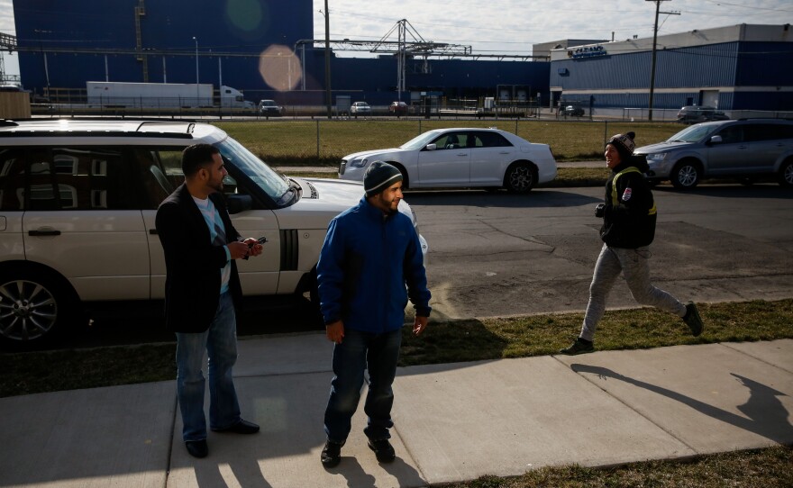 Nabil Nagi and Yunus Wasel outside the Hadwans' home in Hamtramck, Mich.