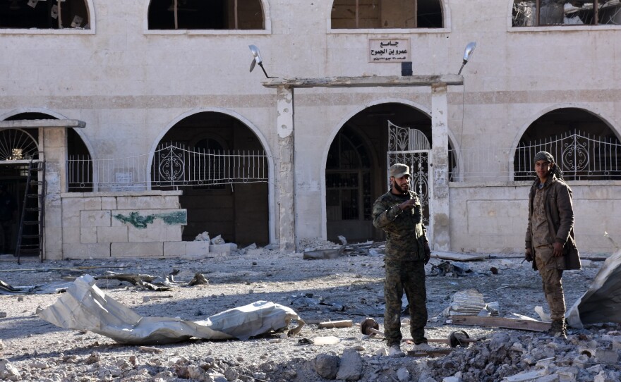 Syrian pro-government forces inspect an area of the Masaken Hanano district in eastern Aleppo on Sunday, a day after they seized it from rebel fighters. The capture of Masaken Hanano — which had been the biggest rebel-held district of Aleppo — was a major breakthrough in a 13-day regime offensive to retake the entire city.