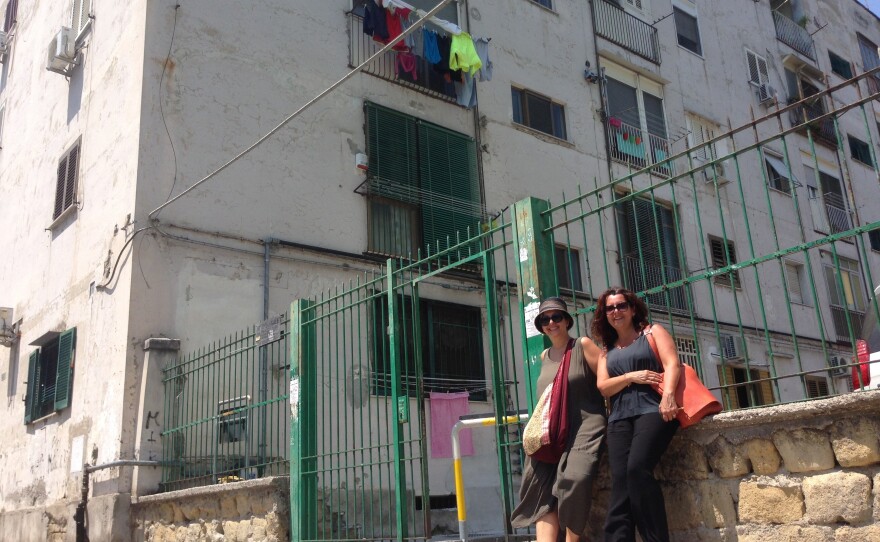 Naples locals Lia Polcari (right), Carmen Vicinanza (left) in front of what they believe to be the childhood home of author Elena Ferrante.