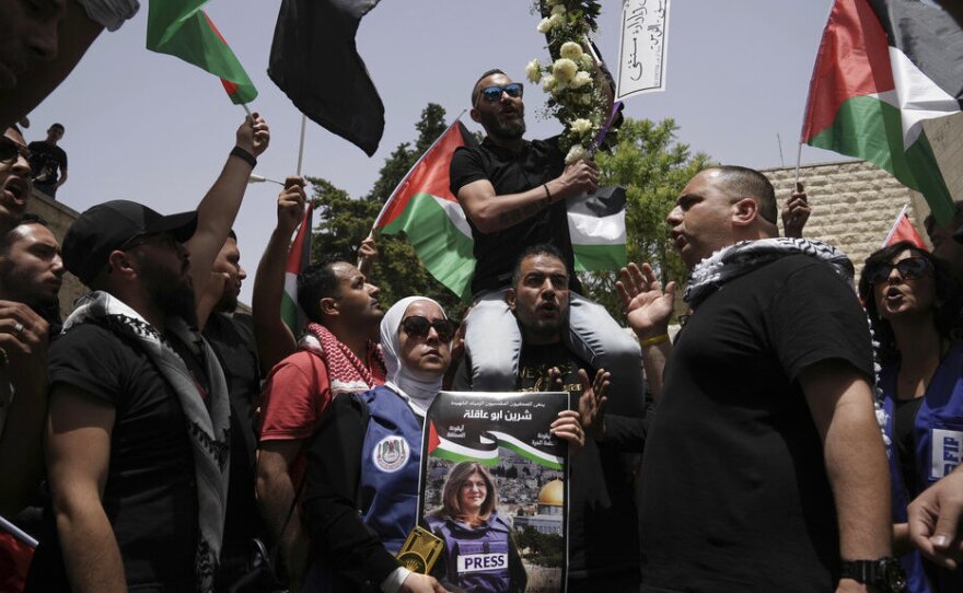 Mourners gather Friday at the hospital where the body of slain Al Jazeera veteran journalist Shireen Abu Akleh will be taken from to to her final resting place, in east Jerusalem.
