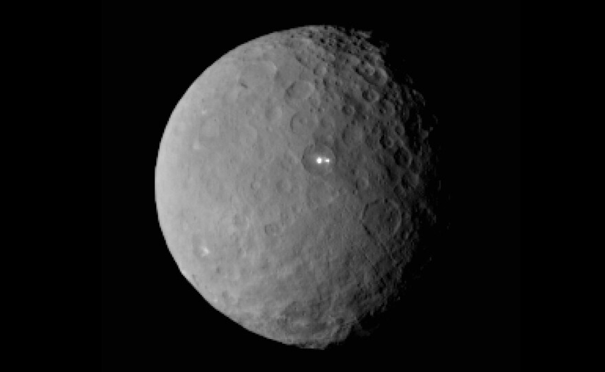 In February, NASA shared this image of Ceres taken by the Dawn spacecraft, showing two bright spots on the dwarf planet.