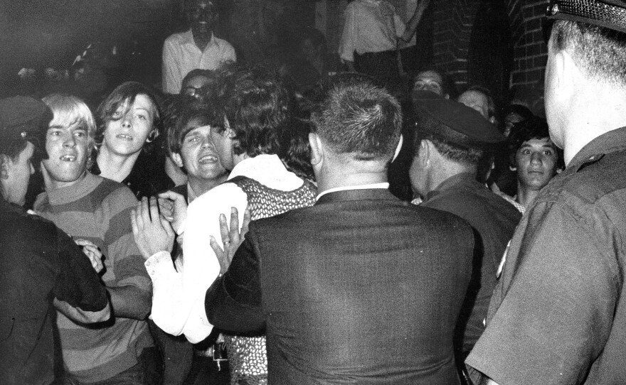A crowd attempts to impede police arrests outside the Stonewall Inn in New York City on June 28, 1969.
