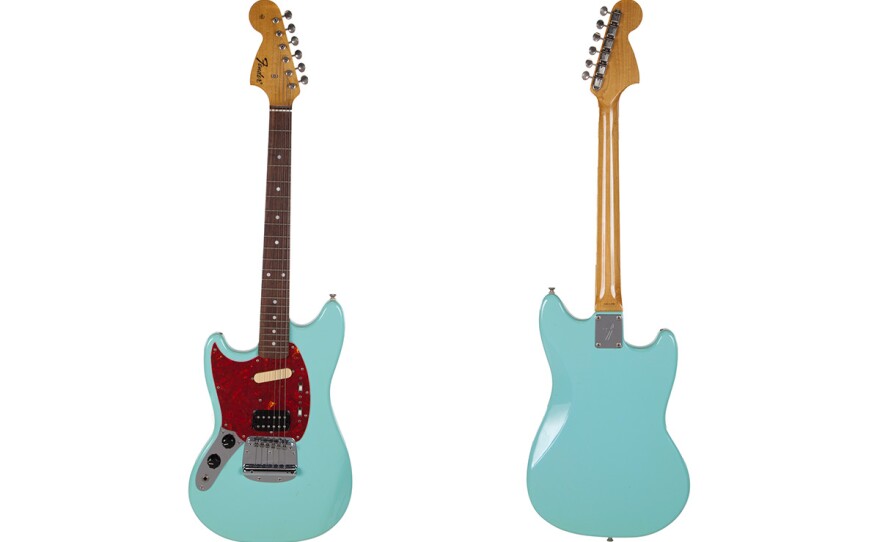 This combination photo of images released by Julien's Auctions shows the front and back of a turquoise-bodied left-handed Fender guitar built in 1993 and used by Nirvana frontman Kurt Cobain during the band’s In Utero tour. 