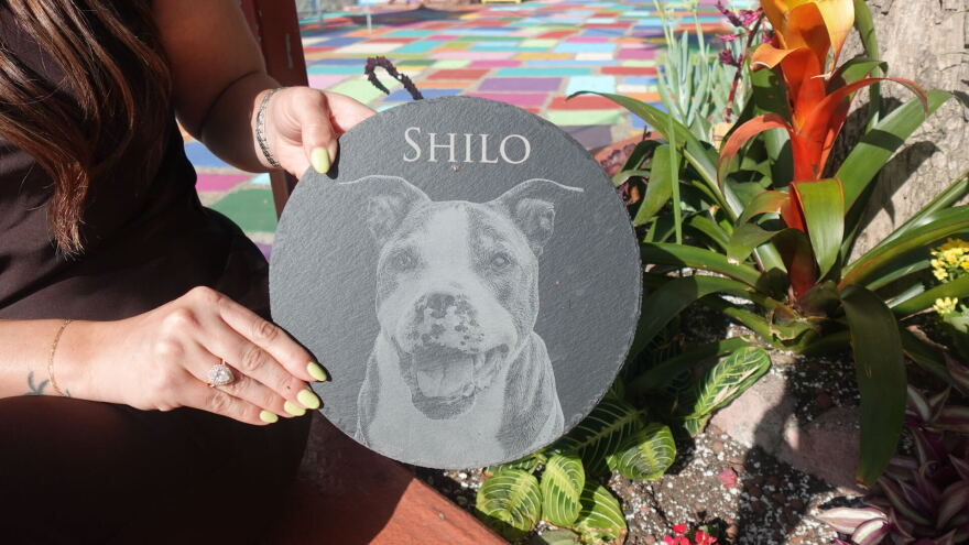 A plaque honoring Amanda Moschella's late dog, Shilo, is part of garden Moschella created at Spanish Village Art Center in Balboa Park on Sept. 14, 2026.