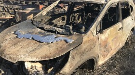  A car burned in the Lilac Fire sits in the neighborhood of the Rancho Monserate Country Club in North San Diego County, Dec. 8, 2017.