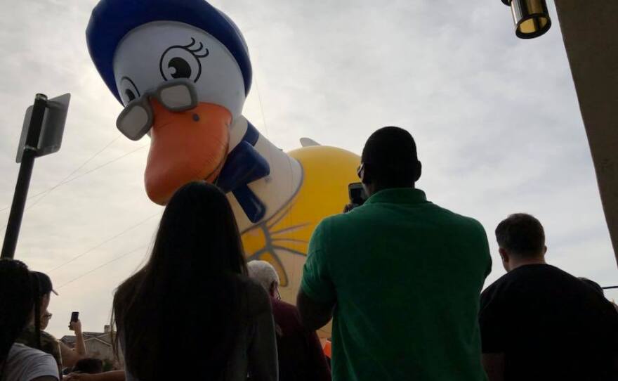 Crowds watching the Mother Goose balloon float by in the Mother Goose Parade in El Cajon, Nov. 19, 2017.