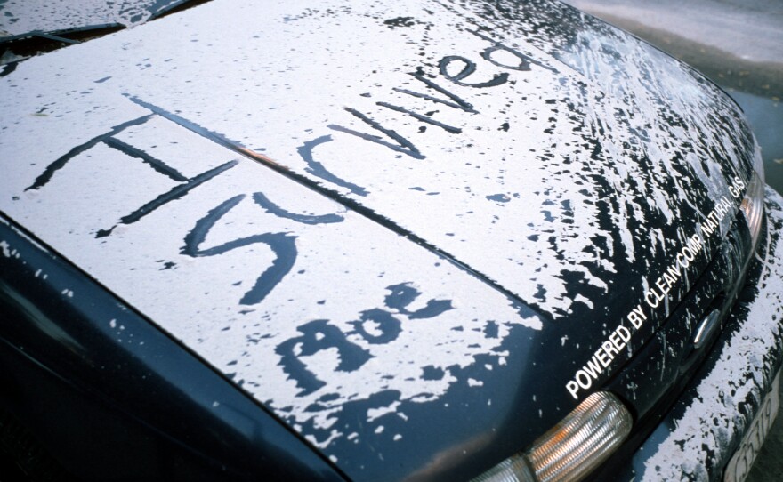 A survivor leaves a message of hope and resilience written in ash in Lower Manhattan.