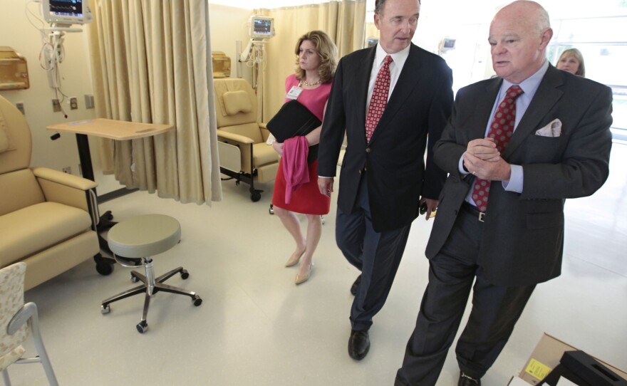 Republican Congressman Dan Lungren (center) tours a cancer center in Sacramento, Calif. Lungren is running for re-election in California's 7th Congressional District.