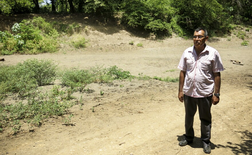 Santos Nicoya Bonillo stands in the dry Brito river bed. Nicoya heads a farmer's cooperative in Tola, Nicaragua. The proposed canal route is set to start at the mouth of the Brito river on the Pacific Ocean. This is the third year of a major drought in southern Central America.