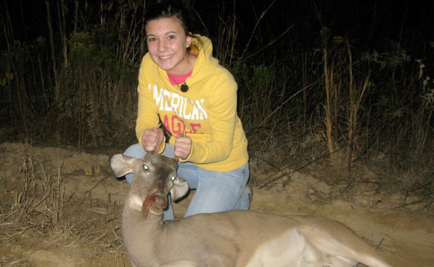 Magan Hebert, 15, poses with the young buck, or "spike," that she shot in Waynesboro, Miss., in November. Magan has been hunting since she was  in the fourth grade.