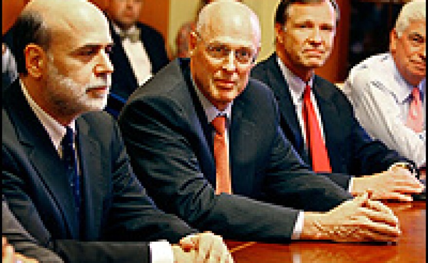 Working on the problem: Treasury Secretary Henry Paulson is flanked by Federal Reserve Chairman Ben Bernanke (left) and SEC Chairman Christopher Cox (right). Chris Dodd, chairman of the Senate Banking Committee, is at the far right of the photo.