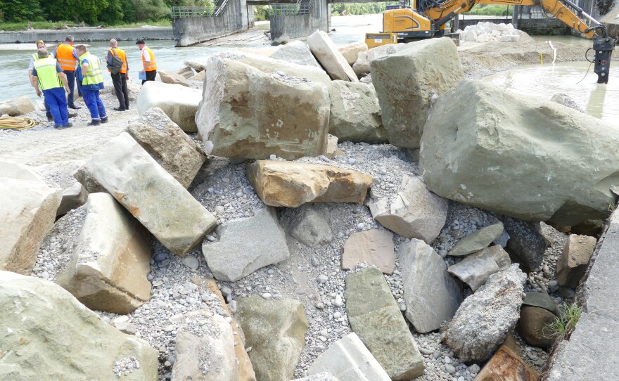 Parts of Munich's main synagogue at the site of their discovery in the Isar river.