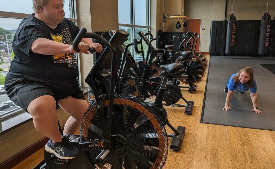 Jason Silverman, on the exercise bike, and his friend Melissa Mills go to the gym together when they hang out. The pair are part of the Friendship Project in Framingham, Massachusetts.
