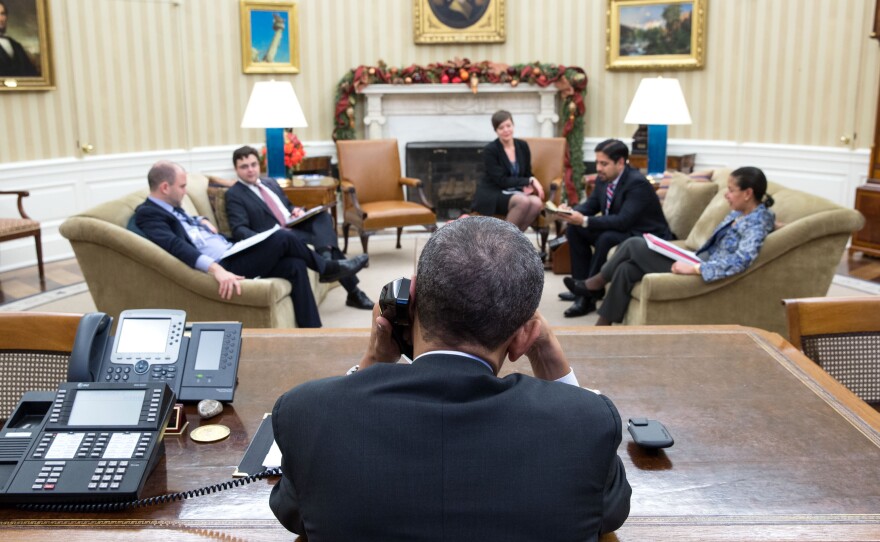 President Obama speaks with President Raul Castro of Cuba from the Oval Office on Tuesday. A day later, both men announced plans to normalize relations between the Cold War-era foes.