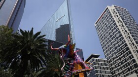 A giant alebrije is paraded on Reforma Avenue in Mexico City, Saturday, Oct. 22, 2022.