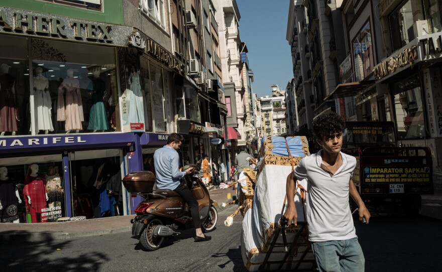 A courier carts goods through the busy commercial district near Beyazit Square — formerly the Forum of Theodosius, built by the Roman emperor Constantine the Great.