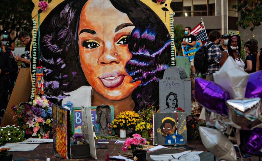 People gather at Breonna Taylors make shift memorial in Injustice Square Park in downtown Louisville.