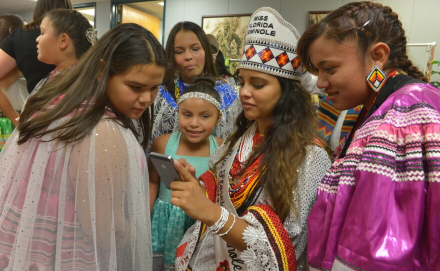 Outgoing Miss Florida Seminole Brianna Nunez, 20, backstage with aspiring contestants for the Jr. Miss Florida Seminole Contest.