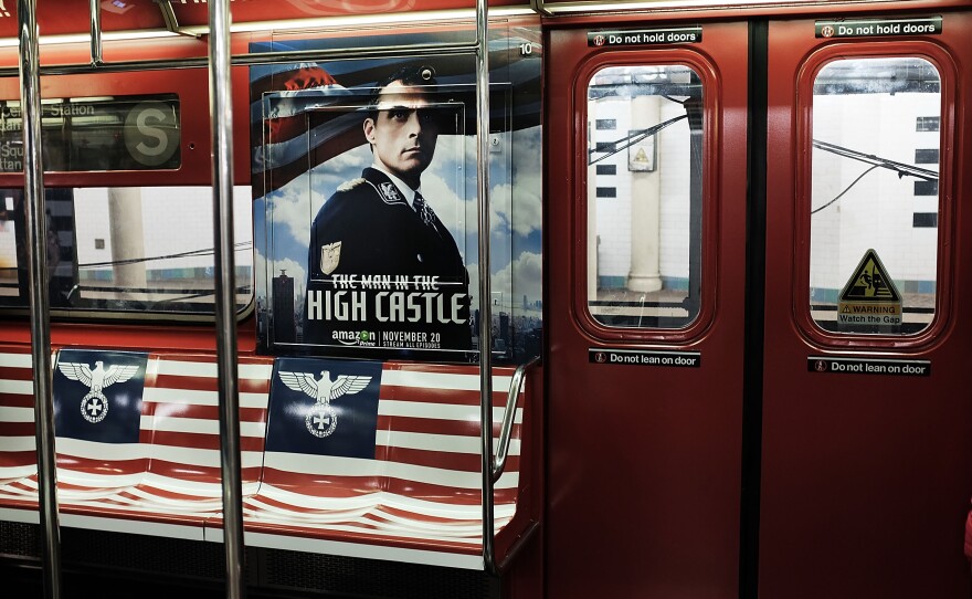 A New York City subway car is covered in Nazi imagery to promote the new Amazon television series The Man in the High Castle. In this photo, the Nazi eagle appears on the American flag where the stars should be.