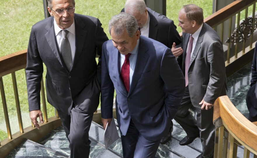 Russian Foreign Minister Sergei Lavrov, left, and Defense Minister Sergei Shoigu, right, walk to their news conference at the Russian Embassy in Washington on Friday.