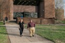 Miranda Lacy and Harold Rogers walk around the campus of West Virginia State University, where both completed undergraduate degrees. They consider the campus a second home because staff there worked hard to make sure their education was accessible. Now, they're in a graduate program that they say has failed to make their learning materials accessible and have filed a lawsuit.