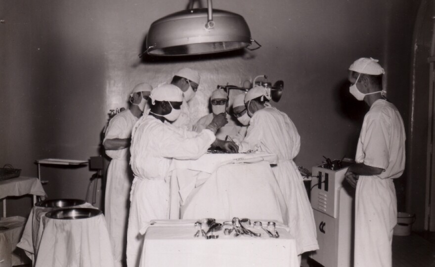 A medical team works on a patient in the prison's infirmary in this undated photo.