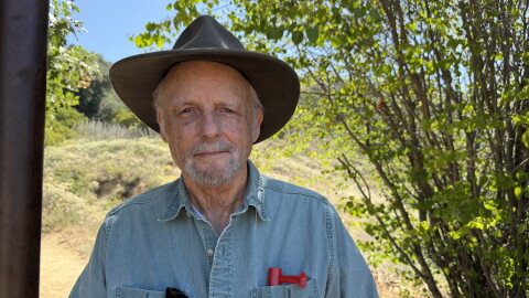 Author Richard Louv stands at the gateway for the Volcan Mountain Trail in Julian, CA on June 26, 2026. His 2005 book, "Last Child in the Woods," introduced the concept of nature-deficit disorder in children. He explores the benefits of slowing down and spending time outdoors in his new book, "Noticing: Intimate Encounters with the Natural World."