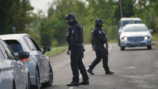 Police guard a road leading to RAF Fairford, in Fairford, England, Monday, Sept. 28, 2026.